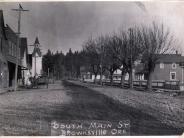 Black and white dirt road and buildings